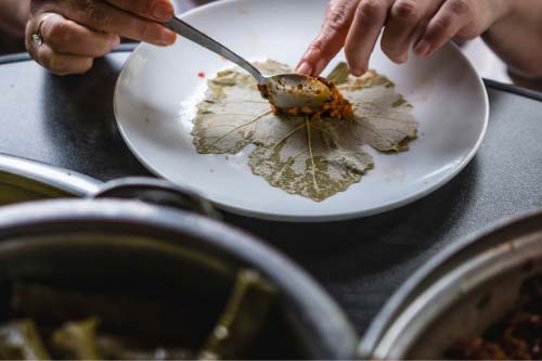 add-stuffing-mixture-on-top-of-grape-leaf